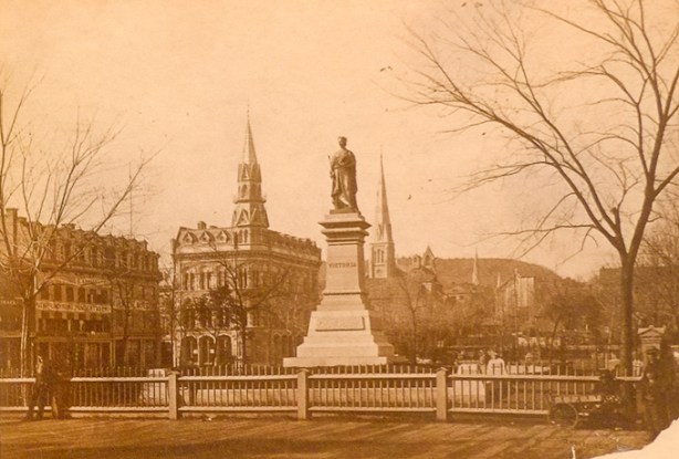 old photo by Alexander Henderson, of Victoria Square in Montreal, albumen print, in a gallery, taken in 1872