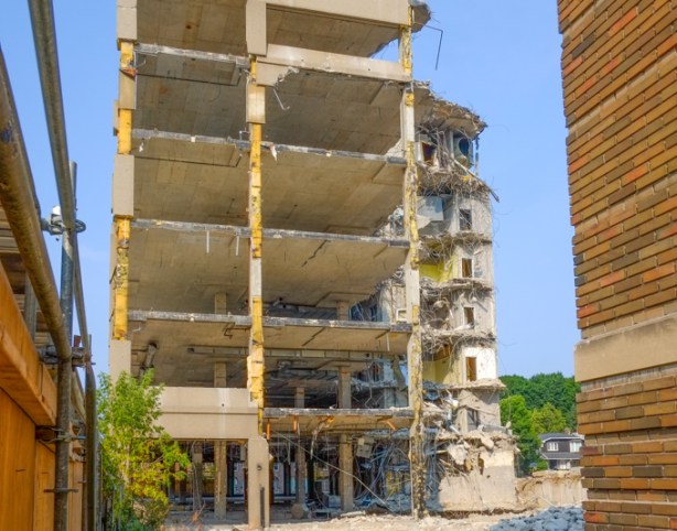 multi level building in the process of being demolished, exterior walls all gone. 