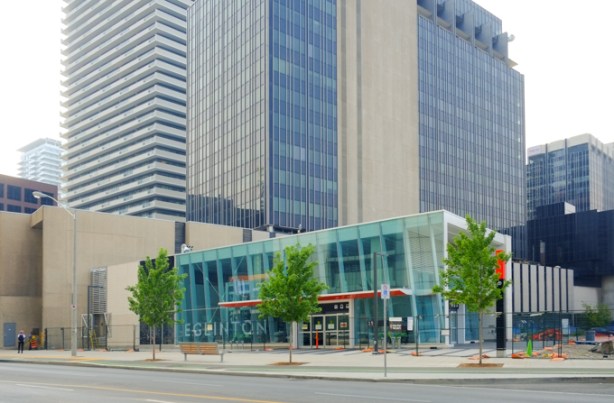 new Eglinton station Metrolinx entrance for LRT and subway, still closed to the public, with older Canada Square buildings around it 