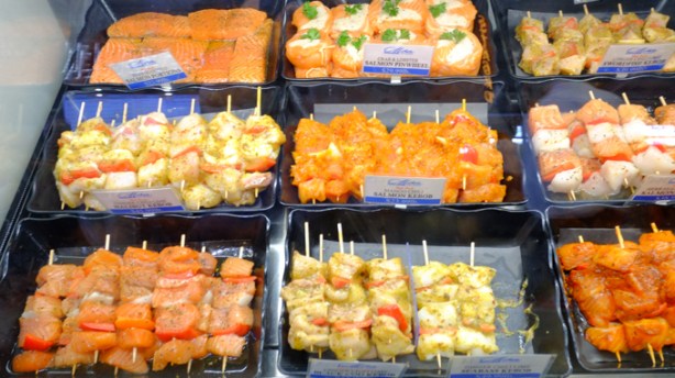 different kinds of kebabs, uncooked, for sale at st. lawrence market, including mango salmon kebabs
