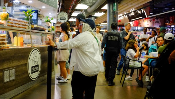 people waiting for food at Yianni's deli counter in st lawrence market