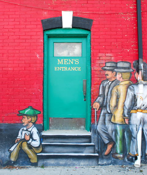 mural, line up of men wanting to enter the duke tavern, men's entrance, plus a boy sitting on the steps outside