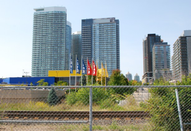 IKEA store and flags, on Esther Shiner Blvd, beside GO railway tracks, 