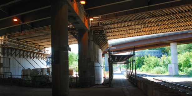 Oriole Go station platform under the 401 highway, with construction