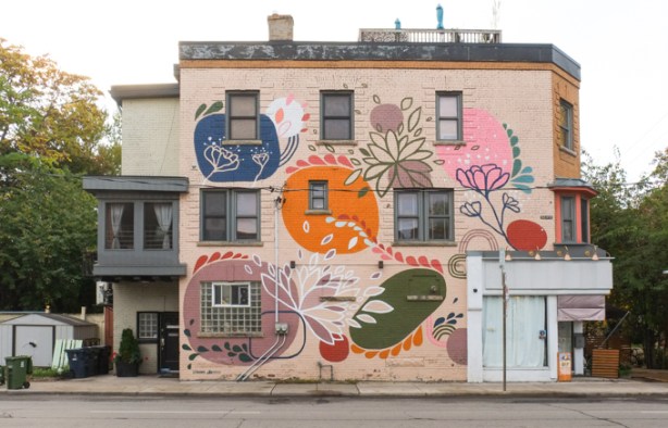 mural on the side of a residential building on Dupont, big circular flowers, by Catherine Cachia