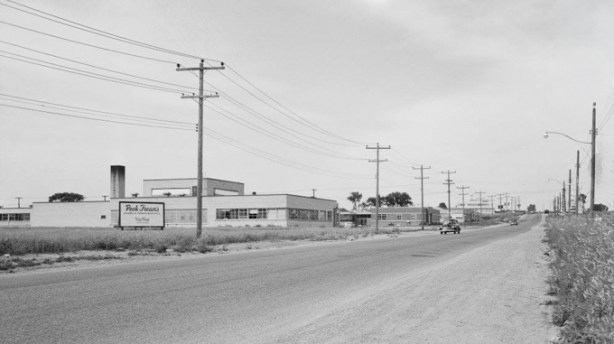 black and white photo of Peek Freans cookie factory in 1950s, on O'Connor drive, not much else is around it , 