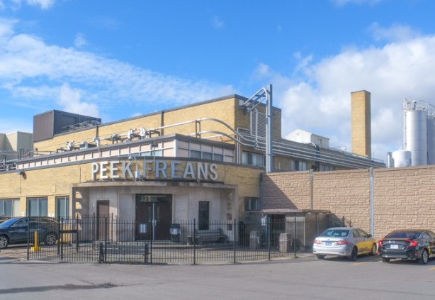 entrance to peek freans cookie factory, a yellow brick building
