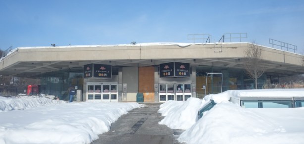 old original round low concrete building that is Cedarvale subway entrance