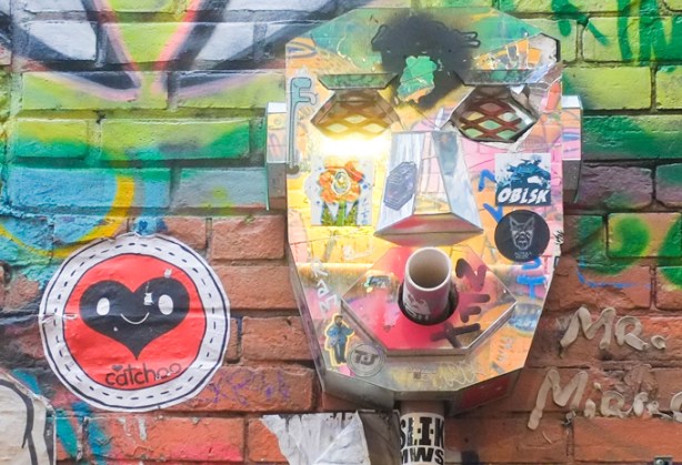 graffiti on a wall in graffiti alley