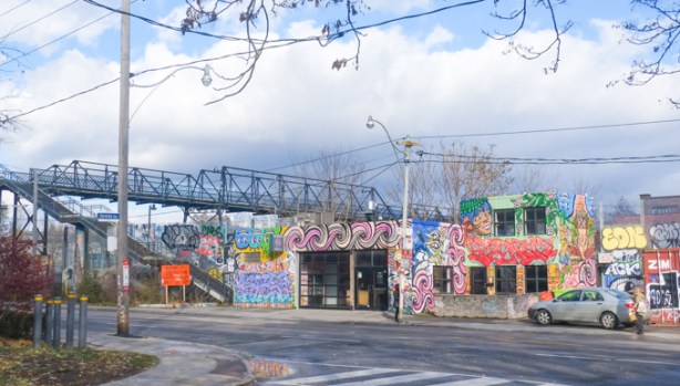 bridge over the train tracks that connect west toronto railpath with dundas street west, graffiti covered