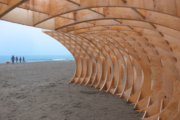 winter stations, public art installation at Woodbine beach, in late March, no snow, title is crest, curved structure made of wood