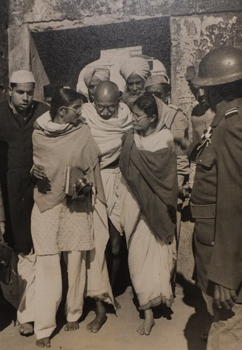 Henri Cartier-Bresson's 1947 photo of Mahatma Gandhi in India, walking between two other people