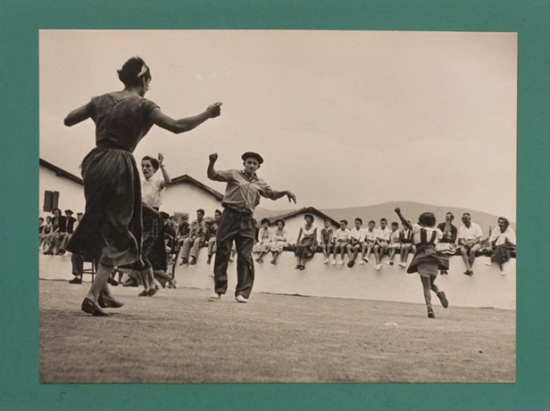 black and white photo pf people dancing, by Robert Capa, village festival, Basque, post war