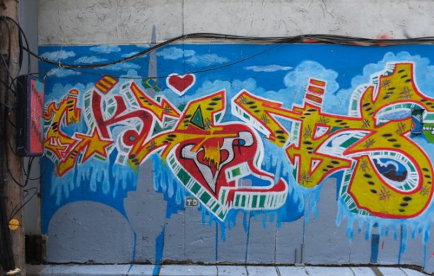 street art mural on blue background, in biscuit lane