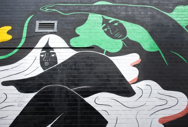 part of a mural by ness lee, black woman with long green or white hair 