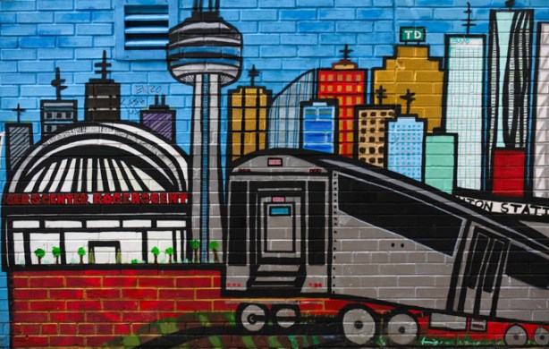 street art mural of downtown Toronto with CN tower, subway, union station rogers centre, tall buildings
