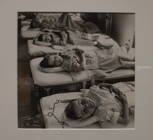 black and white photo by David Seymour, young children in a tuberculosis sanitorium, laying on cots 