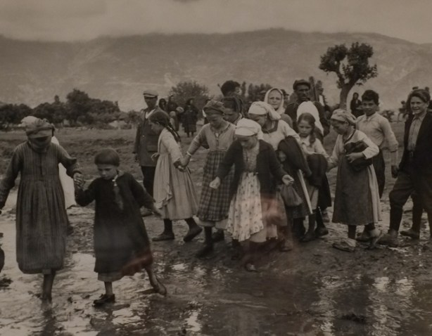 black and white photo by David Seymour, a group of children being led on a walk, crossing a river