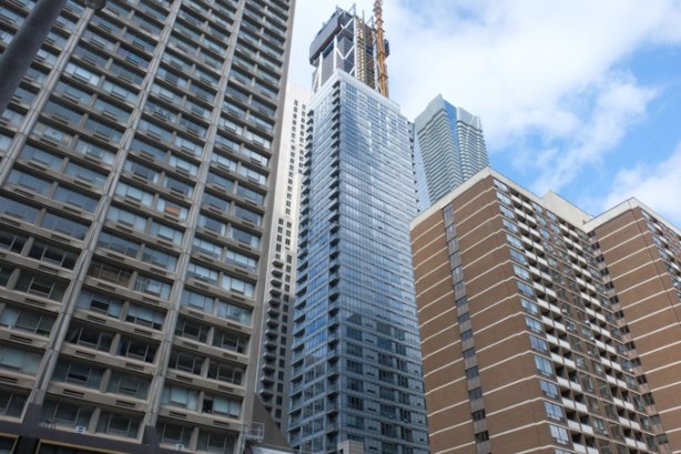 loking skyward, on Charles st east, to tops of highrise buildings