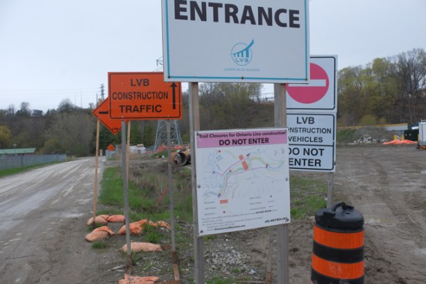 signs at the entrance to a construction site