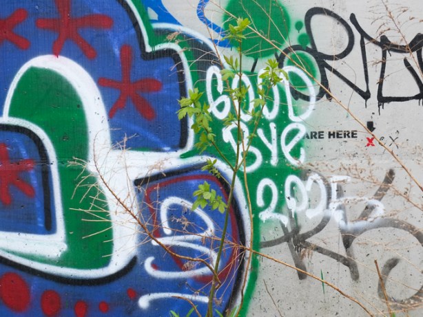 graffiti on wall, you are here, good bye 2025
