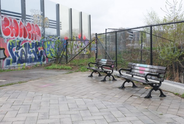 beside the railway tracks, two benches