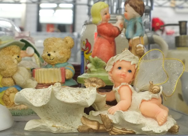collection of figurines for sale in a thrift store