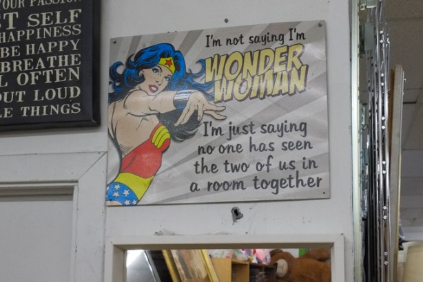 wonder woman poster in a thrift store