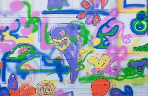 colourful abstract urban art on a white garage door