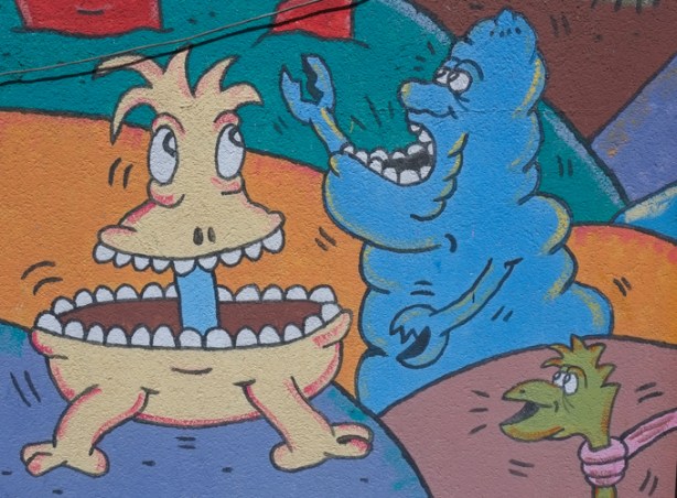 part of a mural by Al Runt, fantasy characters with big mouths and little arms in colourful colours.