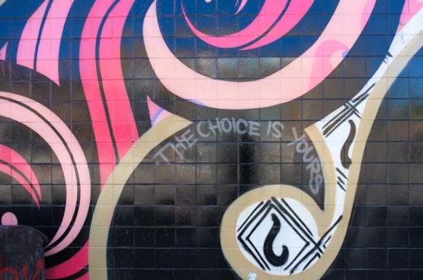 pink and black curves, plus text in white that says the choice is yours