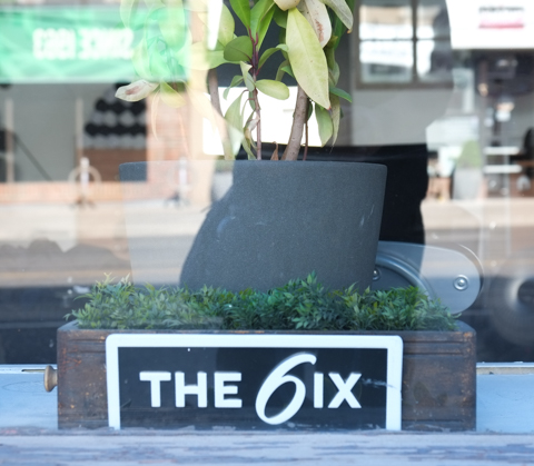 sign in store window that says the 6ix