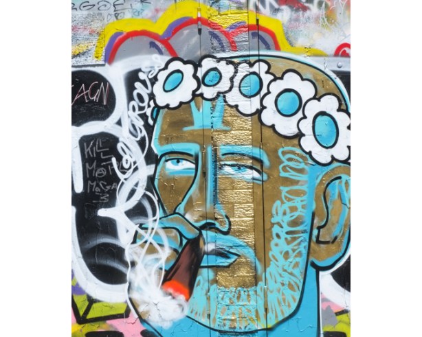 street art painting, gold male face with light blue highlights, wearing garland of blue and white flowers