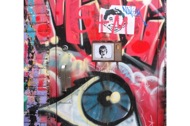 Alfred E. Neuman graffiti, also a woman on a television screen, as well as a very large painted eye
