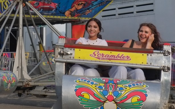 two girls on the scrambler ride at the ex