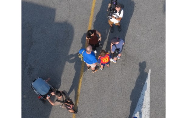 television reporter and cameraman talking to people at the Ex