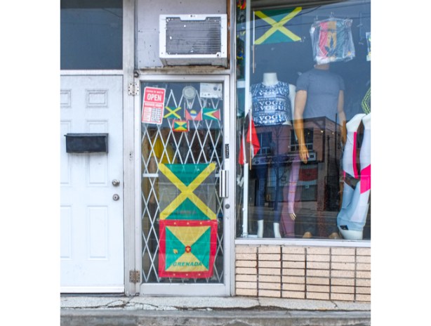 store on Eglinton West with Jamaican flag in the window