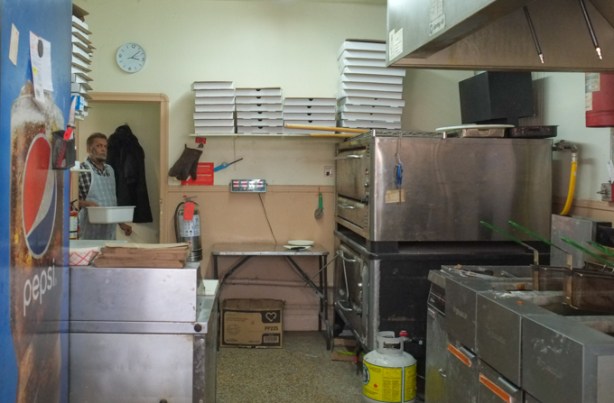 inside a restaurant, view of kitchen area