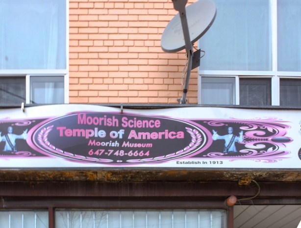 signon outside of building, over door, that says Moorish Science Temple of America