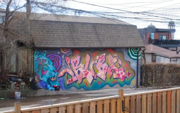 street art on a garage in an alley