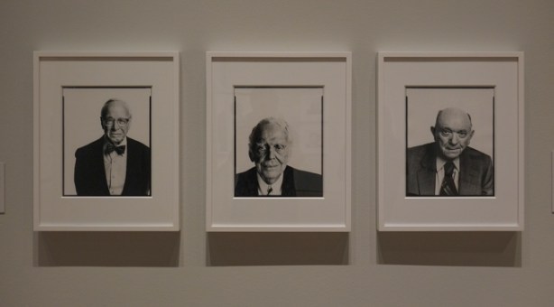 three men, three separate black and white portrait photographs by Richard Avedon hanging on a wall in a gallery, TMU Image Centre