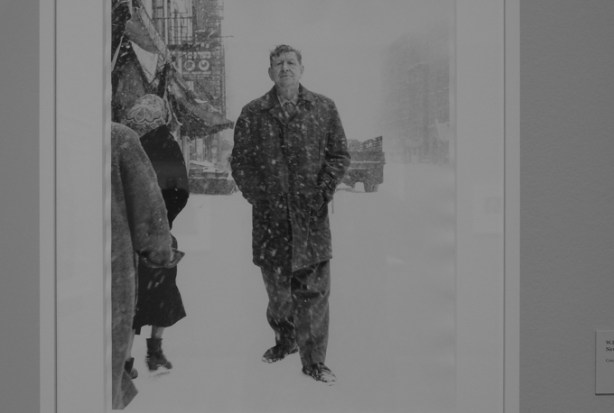 W.H. Auden, poet, in New York City, in a snow storm, , black and white portrait photograph by Richard Avedon hanging on a wall in a gallery, TMU Image Centre