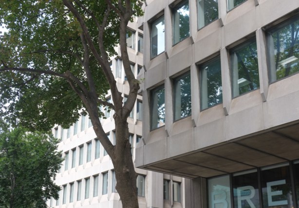 A couple of 1960s/70s brutalist concrete buildings with recessed windows