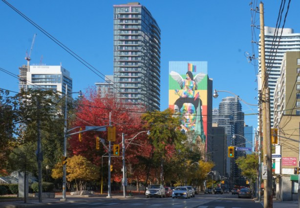 Carleton Street, looking west from Sherbourne, towards Homewood and Jarvis streets, tall buildings, including one with a mural on it, 